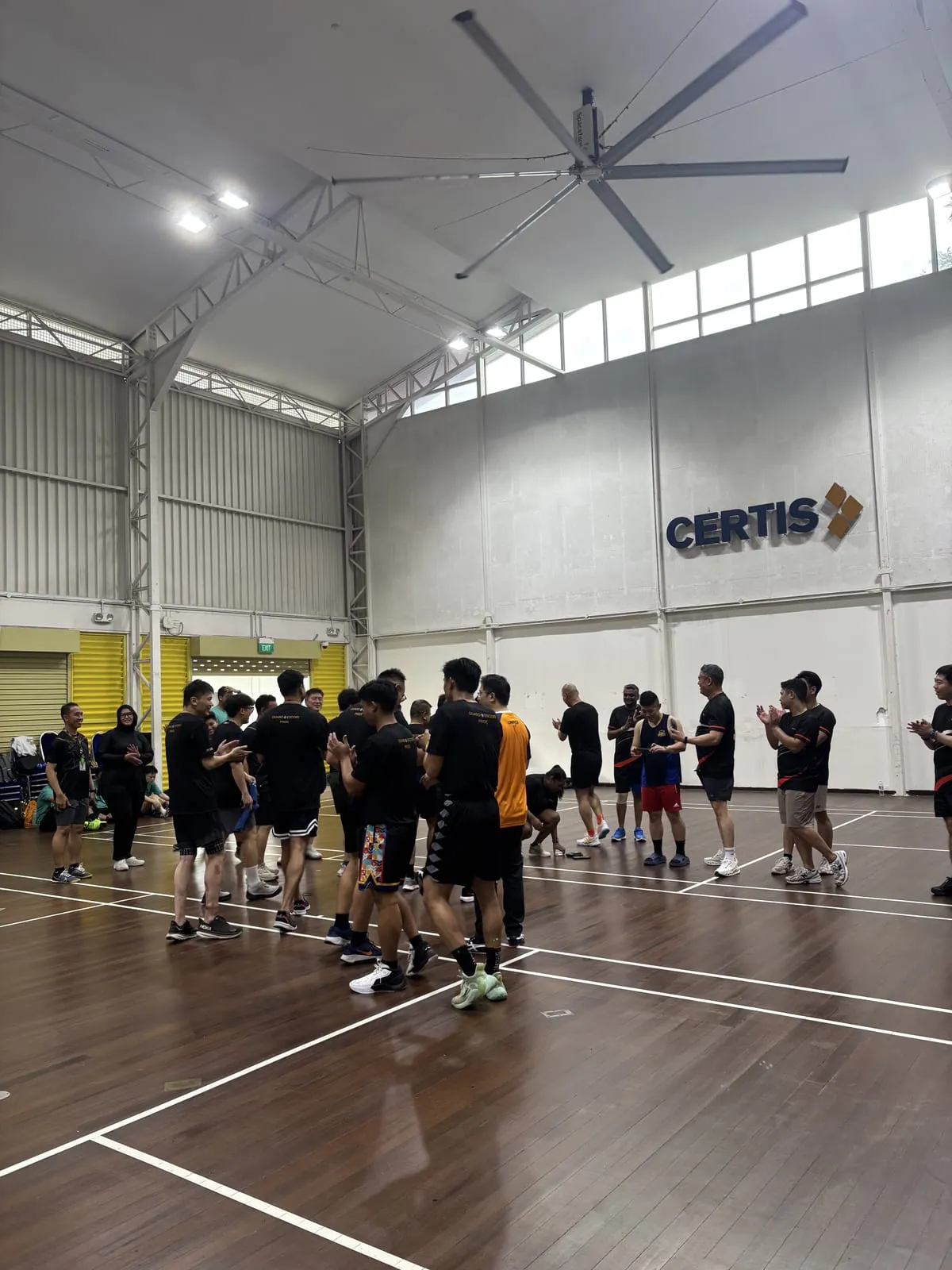 A company team playing captain's ball at their own sports hall